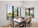 Open dining room with large windows that provide great natural light and views of the tropical trees at 4300 Bayshore Ne Blvd, St Petersburg, FL 33703