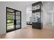 Light-filled foyer with a modern wine display and sleek black-framed windows at 4300 Bayshore Ne Blvd, St Petersburg, FL 33703