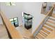 View from stairs of foyer with modern display case at 4300 Bayshore Ne Blvd, St Petersburg, FL 33703