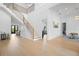 Grand foyer with a modern staircase, beautiful wood floors, and high ceilings at 4300 Bayshore Ne Blvd, St Petersburg, FL 33703