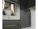 Built-in Thermador coffee system in a modern kitchen with dark cabinets and gold hardware at 4300 Bayshore Ne Blvd, St Petersburg, FL 33703