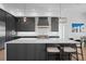 A modern kitchen featuring dark cabinets, white countertops, and stainless steel appliances at 4300 Bayshore Ne Blvd, St Petersburg, FL 33703