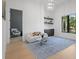 Stylish living room with modern decor, accent lighting, and a large window overlooking the greenery at 4300 Bayshore Ne Blvd, St Petersburg, FL 33703