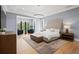 A spacious main bedroom with a sitting area, large windows, and modern decor at 4300 Bayshore Ne Blvd, St Petersburg, FL 33703