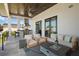 Inviting covered outdoor space with grill area, comfortable seating, and an outdoor kitchen at 4300 Bayshore Ne Blvd, St Petersburg, FL 33703