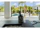 Close-up of an outdoor lounge area with a fire pit and a champagne bucket next to a pool at 4300 Bayshore Ne Blvd, St Petersburg, FL 33703
