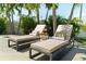 Lounge chairs on a luxury pool deck with decorative pillow and beverage, creating a tropical outdoor oasis at 4300 Bayshore Ne Blvd, St Petersburg, FL 33703