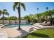 Private backyard pool and spa surrounded by lush landscaping, complemented by a spacious deck for relaxation at 4300 Bayshore Ne Blvd, St Petersburg, FL 33703