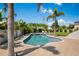 Inviting backyard pool and spa surrounded by palm trees and lush landscaping offering a serene escape at 4300 Bayshore Ne Blvd, St Petersburg, FL 33703