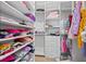 Spacious walk-in closet features an abundance of hanging space, shelves, and drawers for optimal organization at 4300 Bayshore Ne Blvd, St Petersburg, FL 33703
