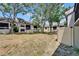 Condo backyard with privacy fence and screened in porch on the upper level at 4709 Puritan Cir # 702, Tampa, FL 33617