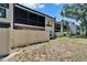Condo backyard with privacy fence and screened in porch on the upper level at 4709 Puritan Cir # 702, Tampa, FL 33617
