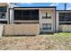 Condo backyard with privacy fence and screened in porch on the upper level at 4709 Puritan Cir # 702, Tampa, FL 33617