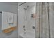 Bright bathroom featuring a white tiled shower and tub combination with neutral-toned accents at 4709 Puritan Cir # 702, Tampa, FL 33617