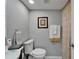 Bathroom featuring a traditional vanity, toilet and framed mirror at 4709 Puritan Cir # 702, Tampa, FL 33617