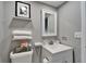 Well-lit bathroom featuring a new vanity, toilet and soft grey walls at 4709 Puritan Cir # 702, Tampa, FL 33617