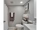 Cozy bathroom featuring a new vanity, toilet and soft grey walls at 4709 Puritan Cir # 702, Tampa, FL 33617