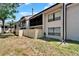 Condo backyard with privacy fence and screened in porch on the upper level at 4709 Puritan Cir # 702, Tampa, FL 33617
