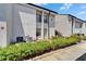 Inviting condo with well-maintained landscaping and exterior stairs to upper level at 4709 Puritan Cir # 702, Tampa, FL 33617