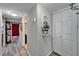 Hallway featuring modern laminate flooring leading to bedrooms and bathrooms at 4709 Puritan Cir # 702, Tampa, FL 33617