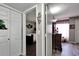 Hallway featuring modern laminate flooring leading to bedrooms and bathrooms at 4709 Puritan Cir # 702, Tampa, FL 33617