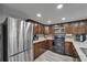 Modern kitchen featuring stainless steel appliances and granite countertops at 4709 Puritan Cir # 702, Tampa, FL 33617