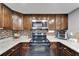 Well-equipped kitchen with stainless steel appliances and granite countertops at 4709 Puritan Cir # 702, Tampa, FL 33617