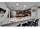 Kitchen featuring granite countertops, stainless appliances, and a breakfast bar at 4709 Puritan Cir # 702, Tampa, FL 33617