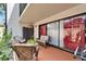 Cozy patio with a comfortable seating area and sliding glass door entrance at 4709 Puritan Cir # 702, Tampa, FL 33617