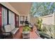 Relaxing patio with comfortable seating, well-kept landscaping, and a grill at 4709 Puritan Cir # 702, Tampa, FL 33617