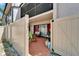 Fenced condo patio with furniture and sliding glass doors to the interior at 4709 Puritan Cir # 702, Tampa, FL 33617