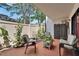 Relaxing outdoor patio featuring comfortable seating and well-maintained landscaping at 4709 Puritan Cir # 702, Tampa, FL 33617