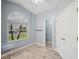 Bright bathroom with large window and a full size door at 4761 Stoneview Cir, Oldsmar, FL 34677