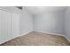 Bright bedroom with a large closet and wood-look flooring at 4761 Stoneview Cir, Oldsmar, FL 34677