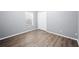 Cozy bedroom features updated vinyl floors and natural light at 4761 Stoneview Cir, Oldsmar, FL 34677