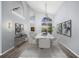 Elegant dining area featuring modern decor, vaulted ceilings, and lots of natural light at 4761 Stoneview Cir, Oldsmar, FL 34677