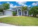 Charming home with a spacious garage, well maintained lawn, and curb appeal at 4761 Stoneview Cir, Oldsmar, FL 34677