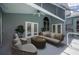 Screened in patio area with wicker furniture and ceiling fan overlooking the pool at 4761 Stoneview Cir, Oldsmar, FL 34677