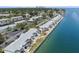 Wide aerial view of waterfront condo community showing waterway and St. Petersburg skyline in background at 4858 Coquina Key Se Dr # C, St Petersburg, FL 33705