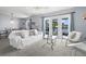 Bright living room with cozy furniture, balcony access, and beautiful water views at 4858 Coquina Key Se Dr # C, St Petersburg, FL 33705