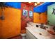 Unique bathroom with decorative walls, marble countertop and under-mounted sink basin at 5115 S Jules Verne Ct, Tampa, FL 33611
