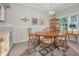 Well lit dining room with chandelier and matching wood table, cabinet, and chairs at 5115 S Jules Verne Ct, Tampa, FL 33611