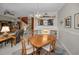 Bright dining room with views to the living room, kitchen, and staircase at 5115 S Jules Verne Ct, Tampa, FL 33611