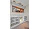 Dining room with built-in cabinets for storage and a kitchen view at 5115 S Jules Verne Ct, Tampa, FL 33611