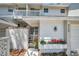 Charming entrance featuring a gated entry and bright red flowers adding a pop of color to the home's exterior at 5115 S Jules Verne Ct, Tampa, FL 33611