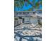 Townhouse exterior with a private balcony, garage, and manicured flower bed at 5115 S Jules Verne Ct, Tampa, FL 33611