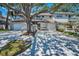 Townhouse exterior with a private balcony, garage, and long driveway at 5115 S Jules Verne Ct, Tampa, FL 33611