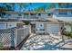 Townhouse exterior featuring a one-car garage, private balcony and covered entry at 5115 S Jules Verne Ct, Tampa, FL 33611
