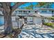 Inviting townhouse featuring a well-manicured lawn, attached garage, and lovely curb appeal, perfect for relaxed living at 5115 S Jules Verne Ct, Tampa, FL 33611