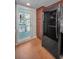 Kitchen view with brick floors and stainless steel refrigerator at 5115 S Jules Verne Ct, Tampa, FL 33611